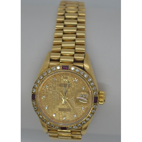 155 - 'Rolex'  A ladies genuine 18ct yellow gold Datejust wristwatch encrusted with diamonds and rubies, h... 