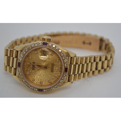 155 - 'Rolex'  A ladies genuine 18ct yellow gold Datejust wristwatch encrusted with diamonds and rubies, h... 