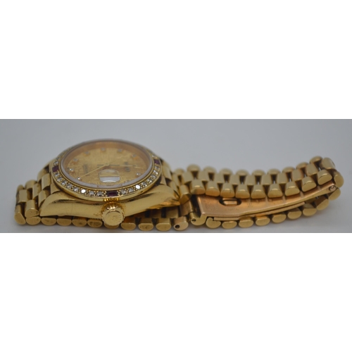 155 - 'Rolex'  A ladies genuine 18ct yellow gold Datejust wristwatch encrusted with diamonds and rubies, h... 