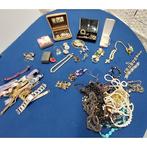 229 - A large quantity of costume jewellery including jewellery boxes, rings, watches necklaces, brooches ... 