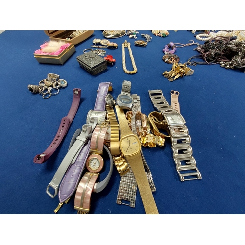 229 - A large quantity of costume jewellery including jewellery boxes, rings, watches necklaces, brooches ... 