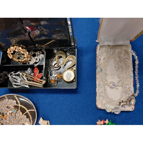 229 - A large quantity of costume jewellery including jewellery boxes, rings, watches necklaces, brooches ... 