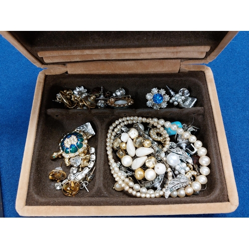 229 - A large quantity of costume jewellery including jewellery boxes, rings, watches necklaces, brooches ... 