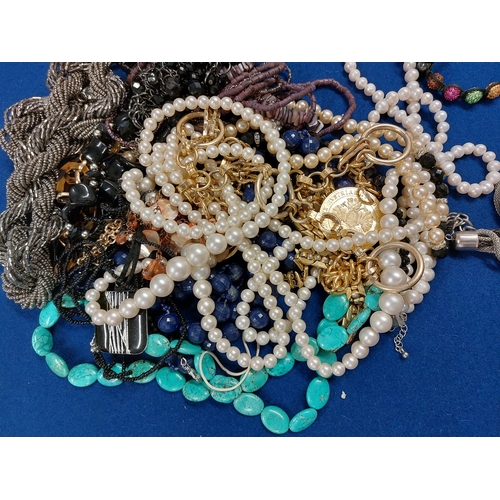 229 - A large quantity of costume jewellery including jewellery boxes, rings, watches necklaces, brooches ... 