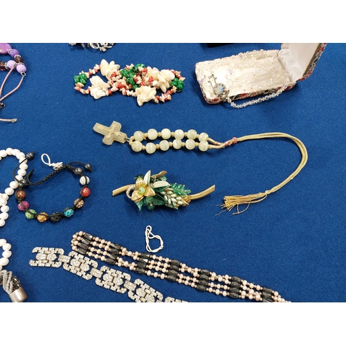 229 - A large quantity of costume jewellery including jewellery boxes, rings, watches necklaces, brooches ... 