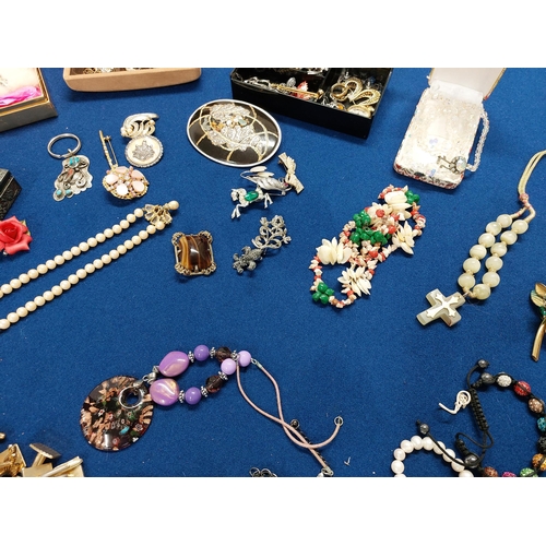 229 - A large quantity of costume jewellery including jewellery boxes, rings, watches necklaces, brooches ... 