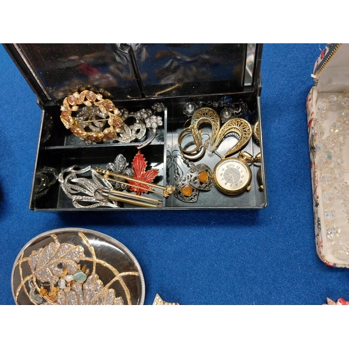 229 - A large quantity of costume jewellery including jewellery boxes, rings, watches necklaces, brooches ... 