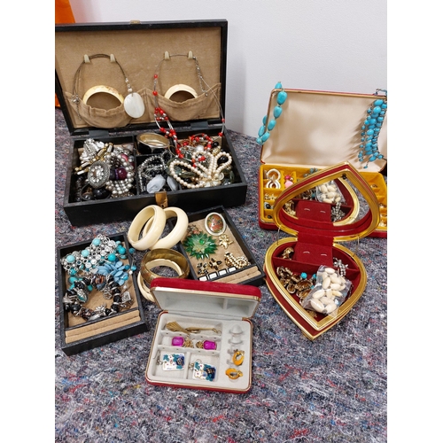 230 - A large quantity of costume jewellery including jewellery boxes, rings, earrings necklaces, brooches... 