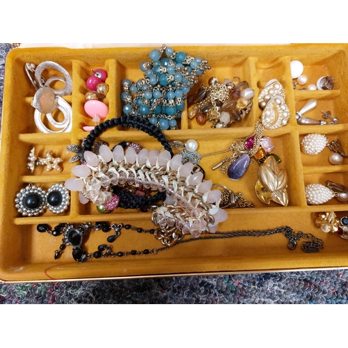 230 - A large quantity of costume jewellery including jewellery boxes, rings, earrings necklaces, brooches... 