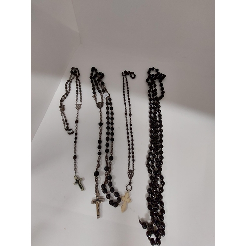 236 - A trio of vintage rosaries together with a faceted necklace (possibly French jet)