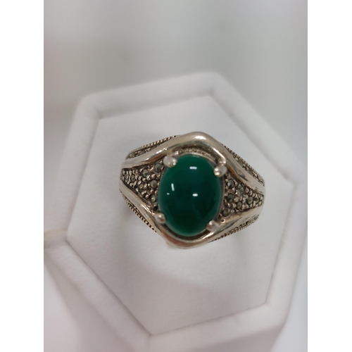 248 - Silver and marcasite rings with green stones,  approx sizes M and size N, stamped 925 with a pair of... 