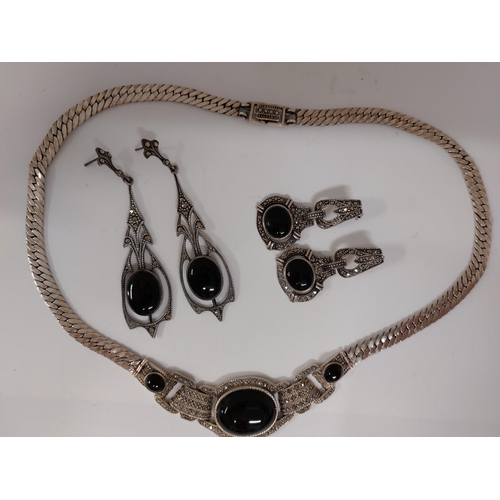 249 - Marcasite and silver jewellery items consisting of a snake chain designed necklace with black centra... 