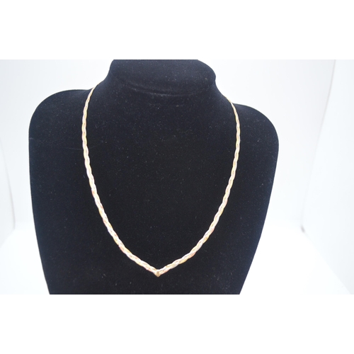 47 - 9ct gold necklace in a plait design of gold, white and rose gold colours, marked Italy 375, approx w... 