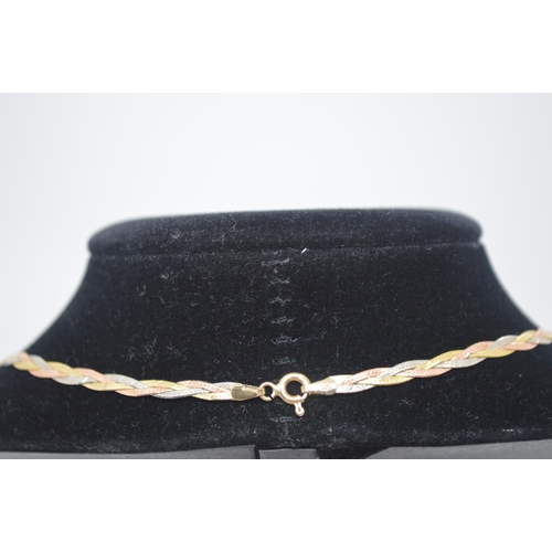 47 - 9ct gold necklace in a plait design of gold, white and rose gold colours, marked Italy 375, approx w... 