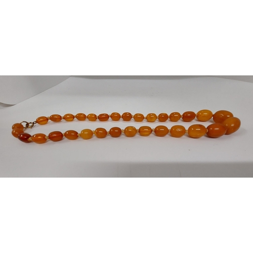 61 - Butterscotch amber necklace on silk cord, approx 20g