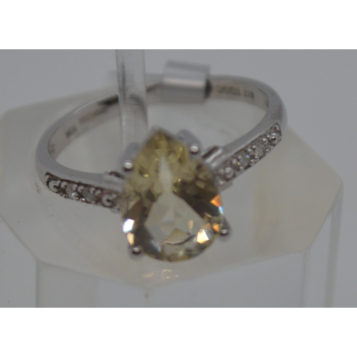 89 - Three modern TGGC gemstone white and yellow gold rings all marked 10k, plus one silver split ring wi... 