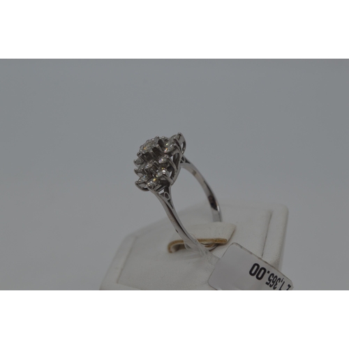 114 - 18ct white gold approx 1.10ct diamond cluster ring, Radiating oval splayed cluster design from centr... 