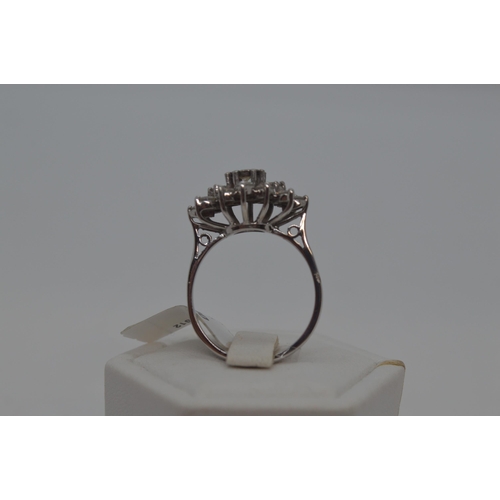 114 - 18ct white gold approx 1.10ct diamond cluster ring, Radiating oval splayed cluster design from centr... 