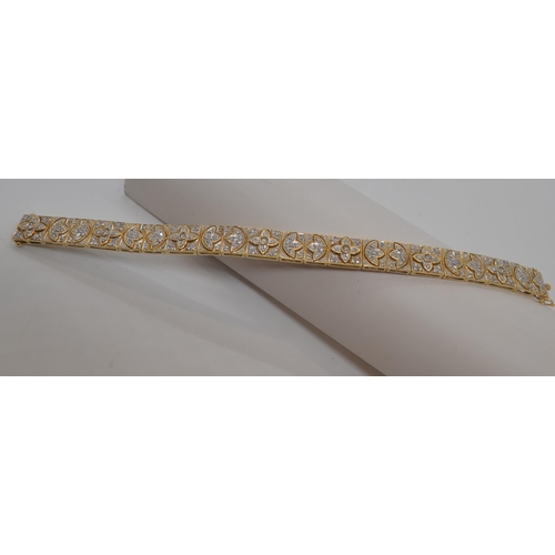 142 - Stunning 14ct gold and diamond cocktail bracelet with push clasp, design depicts multiple rows of di... 