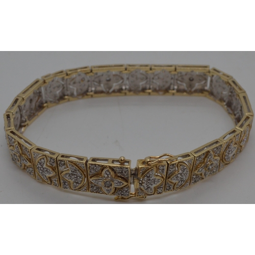 142 - Stunning 14ct gold and diamond cocktail bracelet with push clasp, design depicts multiple rows of di... 