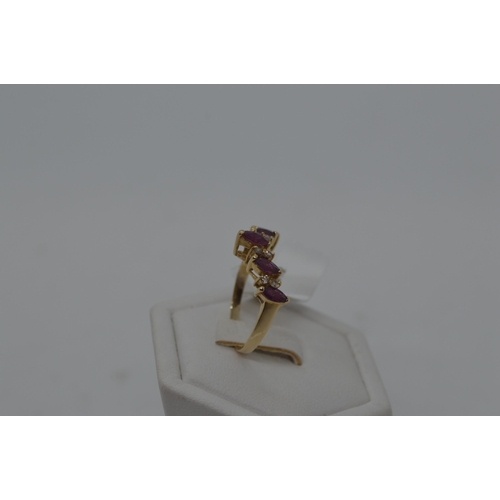 177 - A 14ct yellow gold ring in a wishbone design featuring marquise pink stone and diamonds, stamped 14k... 