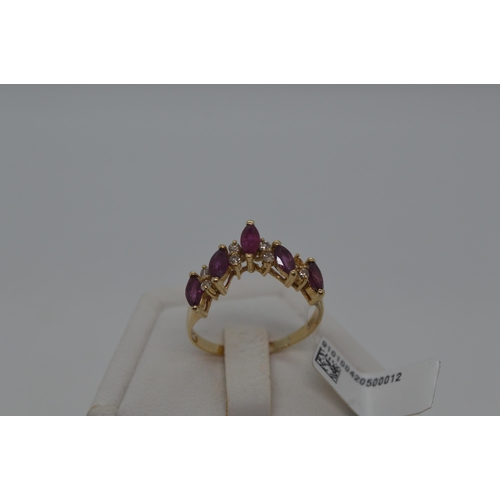 177 - A 14ct yellow gold ring in a wishbone design featuring marquise pink stone and diamonds, stamped 14k... 