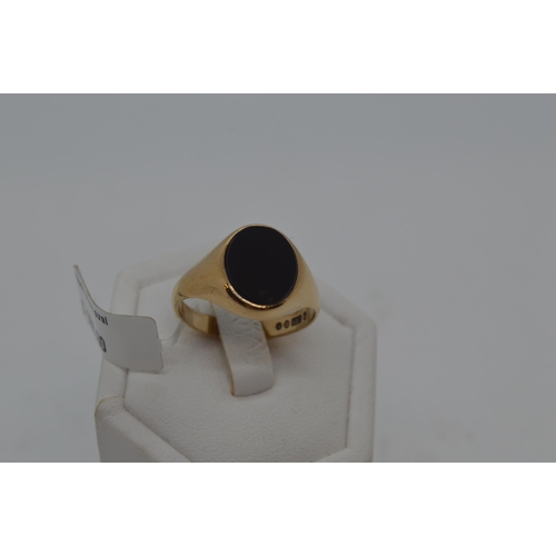 178 - Gents 9ct yellow gold signet ring with oval Black stone, approx size R, fully hallmarked. Approx gro... 