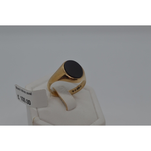 178 - Gents 9ct yellow gold signet ring with oval Black stone, approx size R, fully hallmarked. Approx gro... 