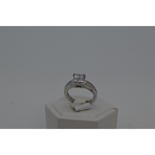 188 - 18ct white gold diamond ring in square from central design with x10 accent diamonds to shoulder, tot... 