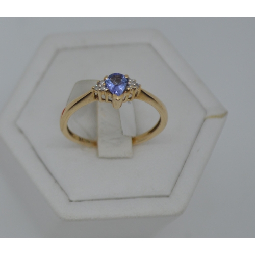 198 - 9ct yellow gold Tanzanite and diamond ring. Central Tanzanite stone of pear shaped form, hallmarked ... 