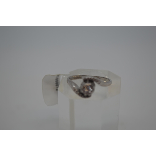 204 - 18ct white gold ring with central diamond stone 0.10ct in a swirl design, Hallmarked 18ct Birmingham... 