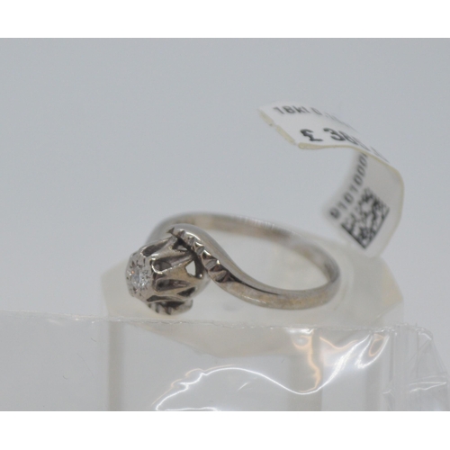 204 - 18ct white gold ring with central diamond stone 0.10ct in a swirl design, Hallmarked 18ct Birmingham... 