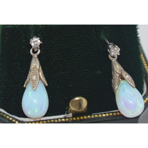 243 - A pair of 9ct white gold opal pendant drop earrings, stamped 375