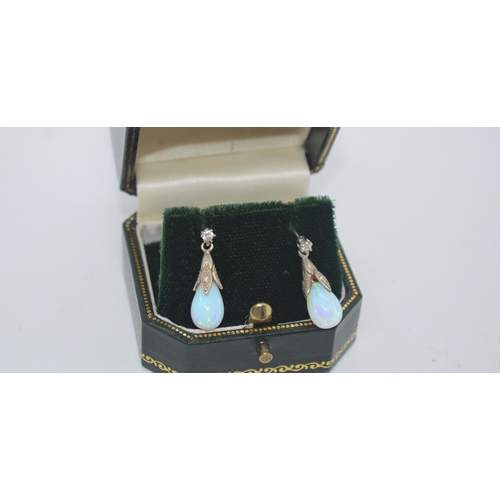 243 - A pair of 9ct white gold opal pendant drop earrings, stamped 375