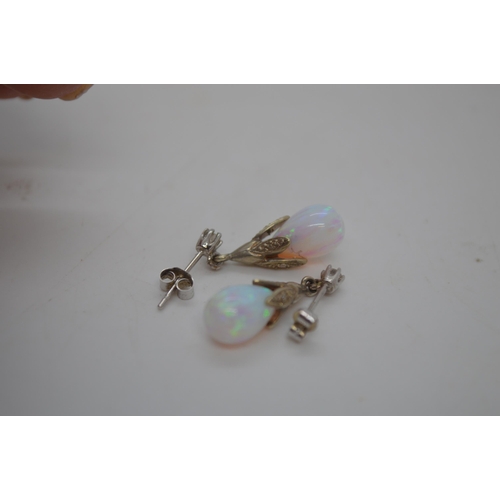 243 - A pair of 9ct white gold opal pendant drop earrings, stamped 375