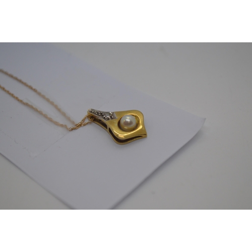 40 - A 14ct yellow gold pendant with Pearl and diamond, stamped 585 with gold chain  marked ZRT 10K