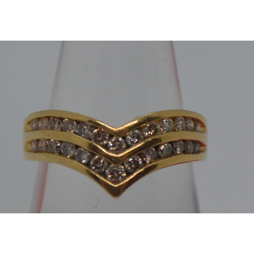 123 - 18ct yellow gold double row of diamonds (26 graduating stones) in a wishbone design ring, stamped 18... 