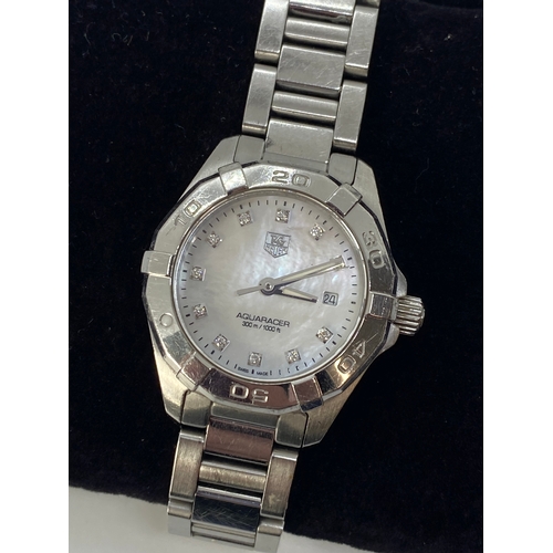 166 - A ladies Tag Heuer Aquaracer WAY1413 stainless steel wristwatch with mother of pearl dial, diamond s... 