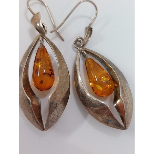 246 - A pair of silver and amber drop pendant earrings