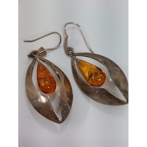 246 - A pair of silver and amber drop pendant earrings