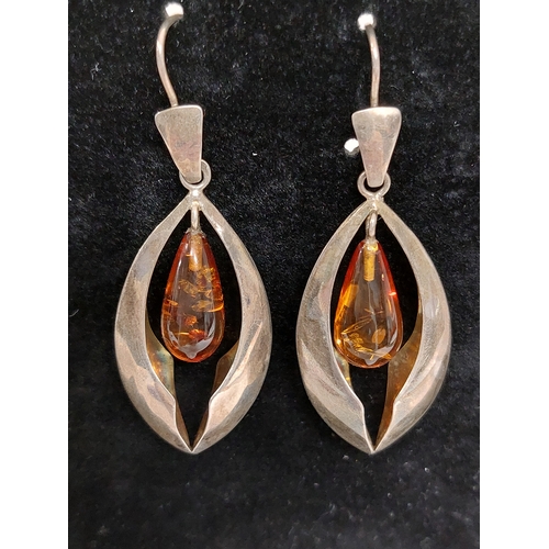 246 - A pair of silver and amber drop pendant earrings