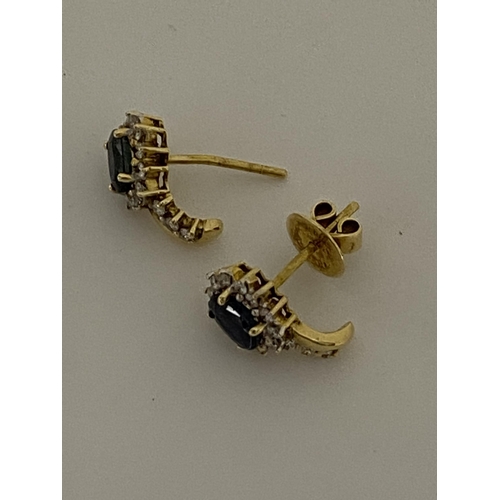 149 - A pair of 18ct yellow gold sapphire and diamond cluster earrings, approx gross s1ct, d0.60. Unmarked... 