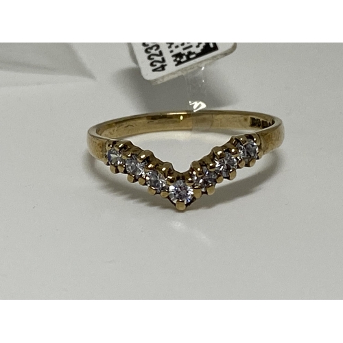 176 - 9ct Yellow gold seven stone diamond wishbone ring, approx size m, approx 0.21ct, hallmarked 375.  Th... 