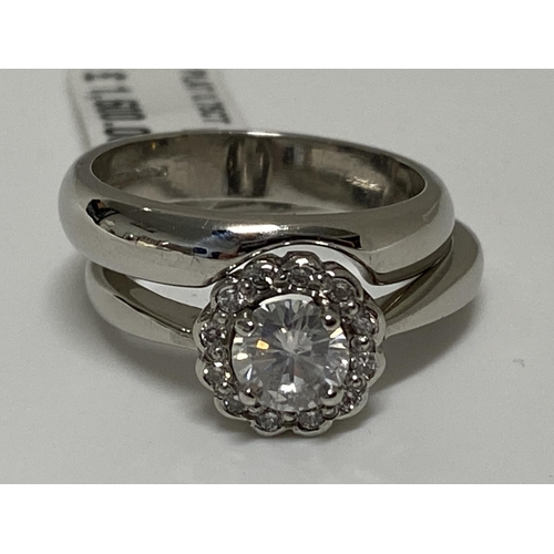 191 - Platinum two-piece diamond cluster ring and interlocking band set, central stone in raised claw sett... 