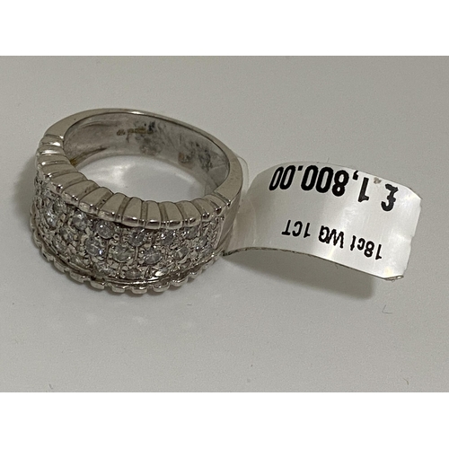 76 - 18 ct white gold 1ct diamond ring consisting of three rows of diamonds set into the thick band, hall... 