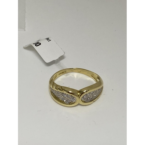 81 - 18ct gold 0.60ct diamond ring in a bow design.  Hallmarked 750 London.  Approx sie o, approx weight ... 