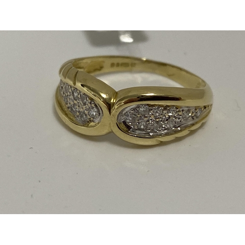 81 - 18ct gold 0.60ct diamond ring in a bow design.  Hallmarked 750 London.  Approx sie o, approx weight ... 