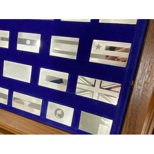 271 - John Pinches Limited – Display chest containing ‘The Flags of the United Nations’ full two drawer si... 