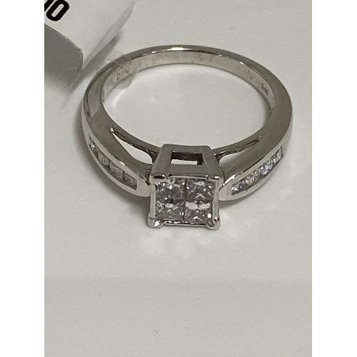 189 - 18ct white gold  diamond ring, approx size 0.60cts of diamond in a square design with diamonds to mo... 