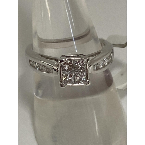 189 - 18ct white gold  diamond ring, approx size 0.60cts of diamond in a square design with diamonds to mo... 